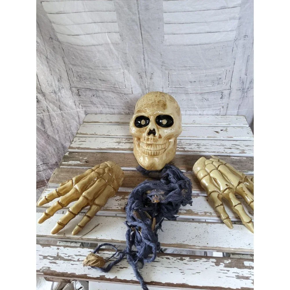 Skull skeleton head hands ground breaker lawn deco